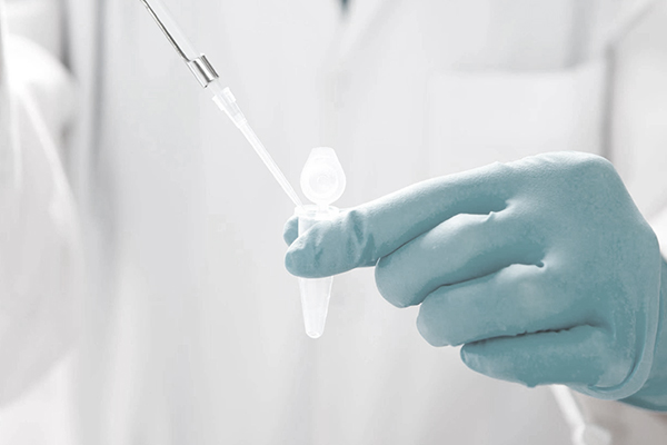 Laboratory pipetting into a sample tube during molecular testing