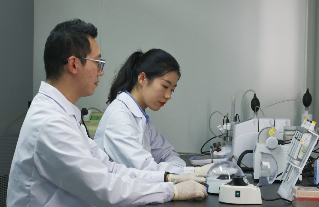 Laboratory professionals conducting molecular diagnostic testing with laboratory equipment